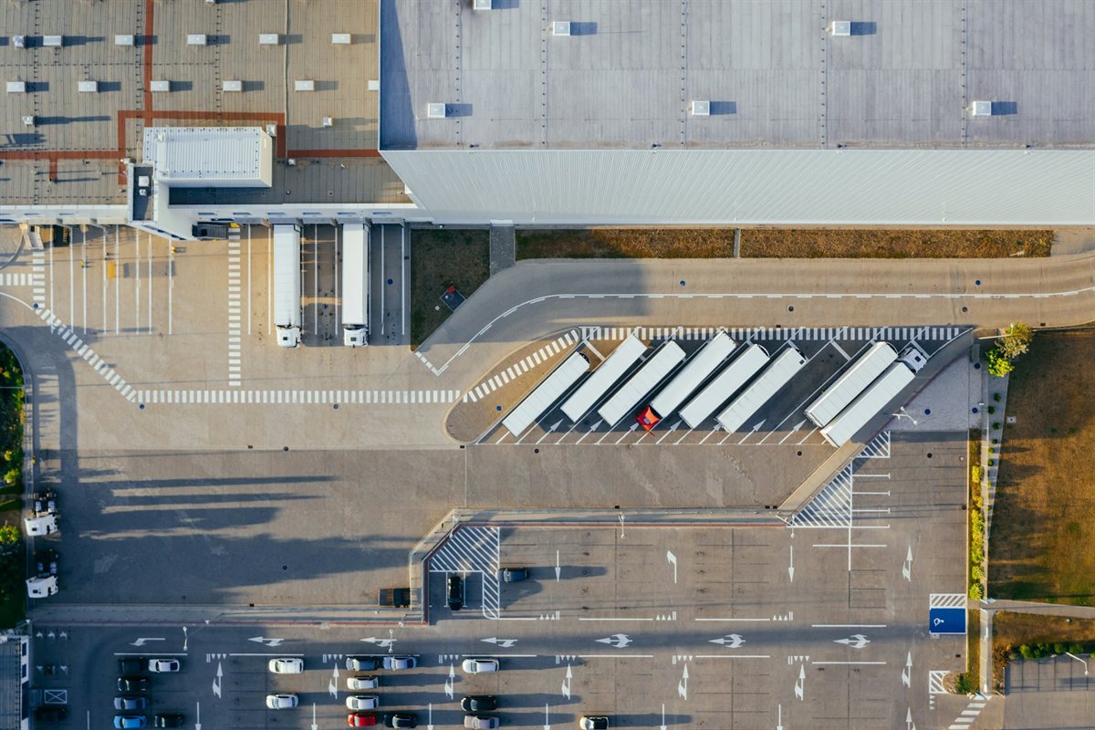 Trucks docked at a distribution facility seen from above